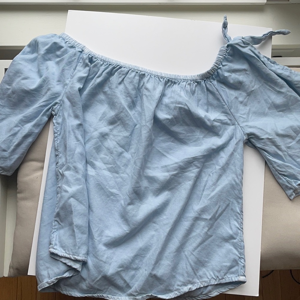 Off the shoulder periwinkle top.